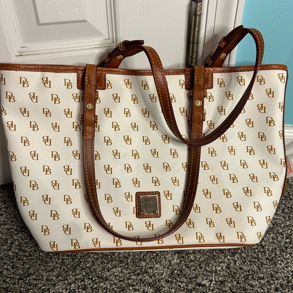 Dooney & Burke ivory colored purse with red interior